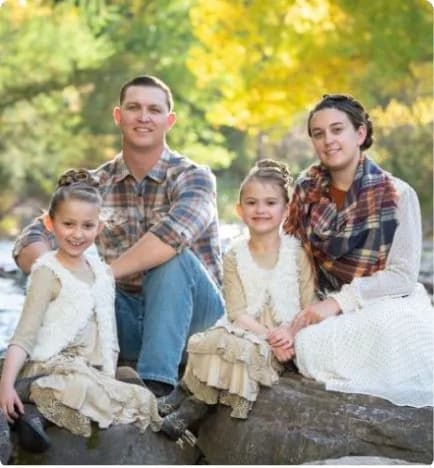 A Diamond Cut Landscape owner's family by a creek in autumn