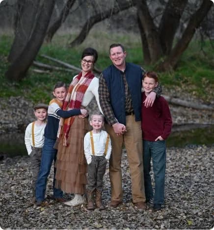 A Diamond Cut Landscape owner's family outdoors among the trees