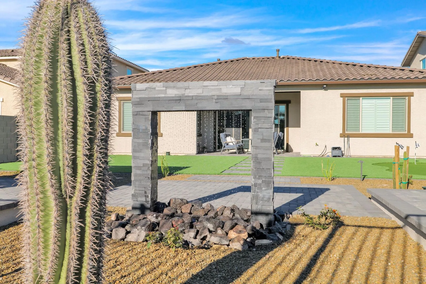 Backyard desert planting with a mature saguaro and decomposed granite by Diamond Cut Landscape