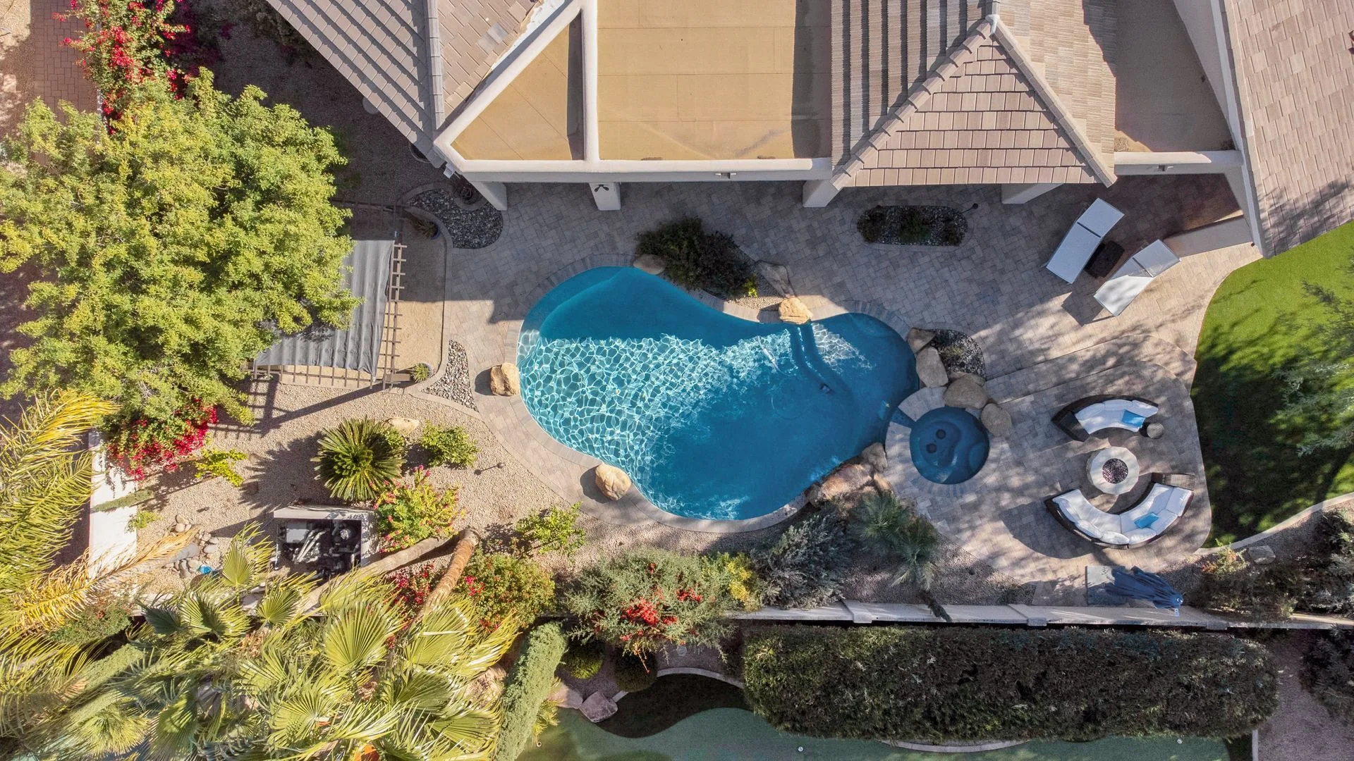 Aerial of a fully designed Phoenix backyard with pool, spa, and planting