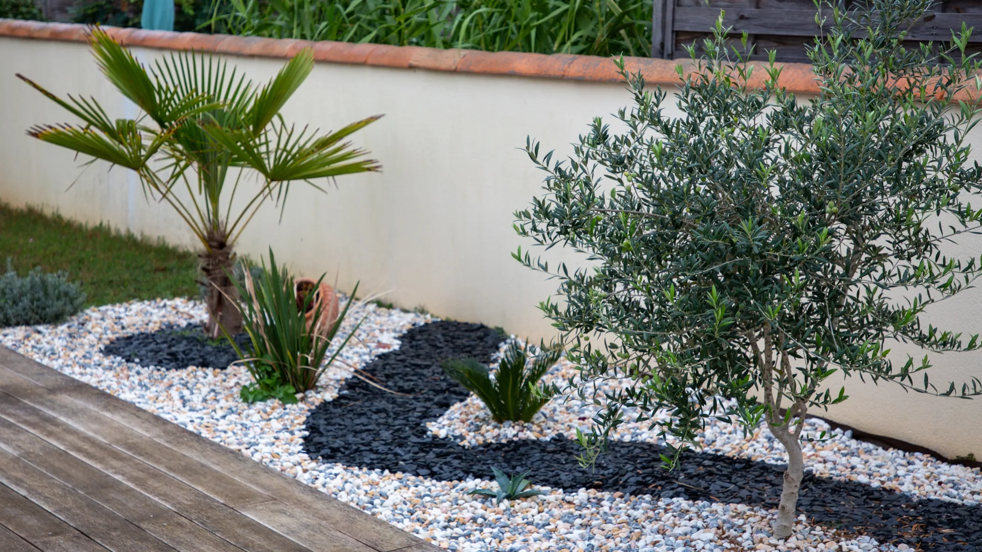 Decorative gravel and stone laid in a clean, weed-suppressing bed